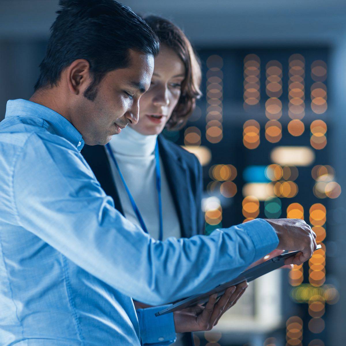 Two professionals working on an Internal Assessment