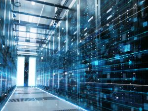 A wide blue hallway of a data center which is fully operational and prepared to handle any new software updates.