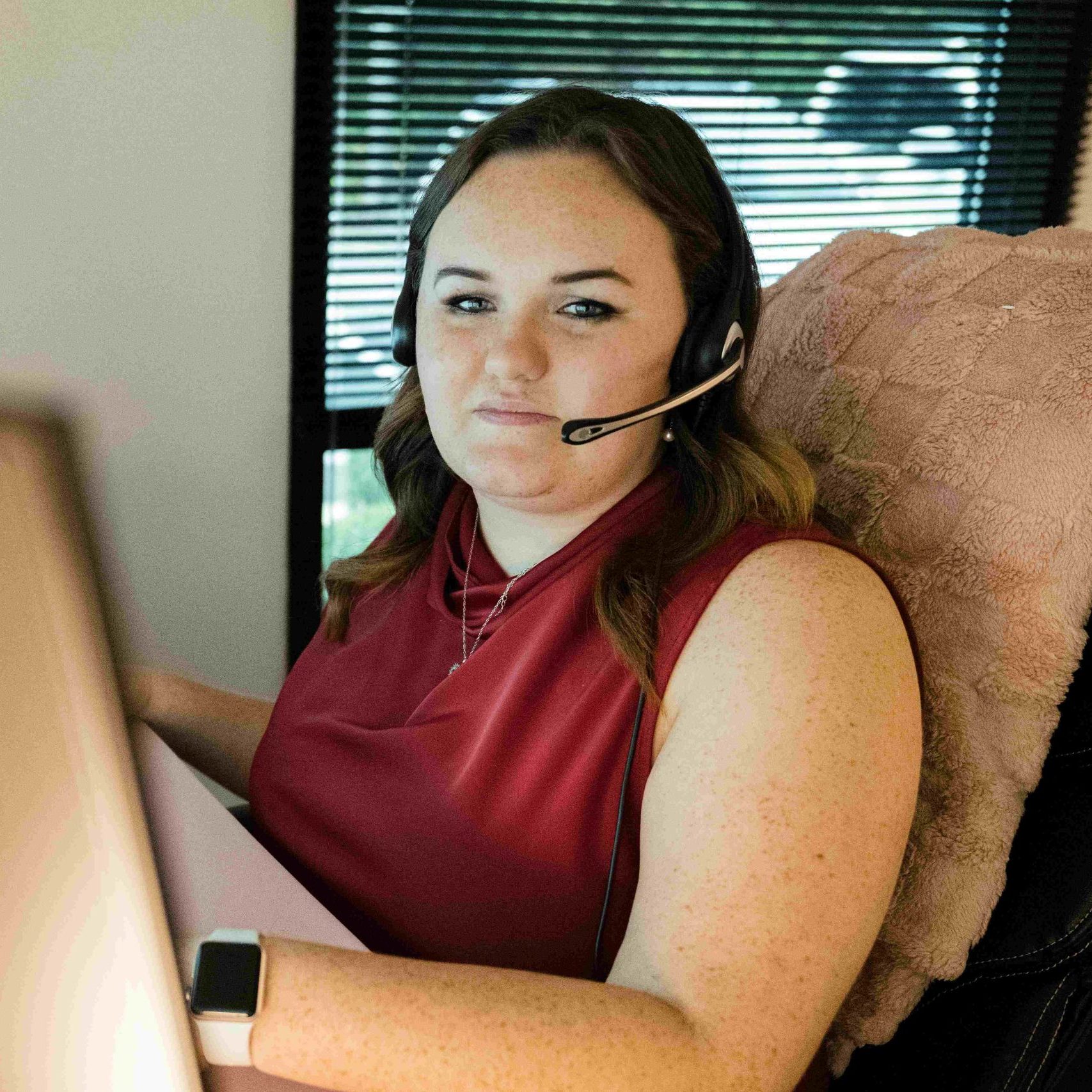 A Clear Winds help desk team member wearing a headset.