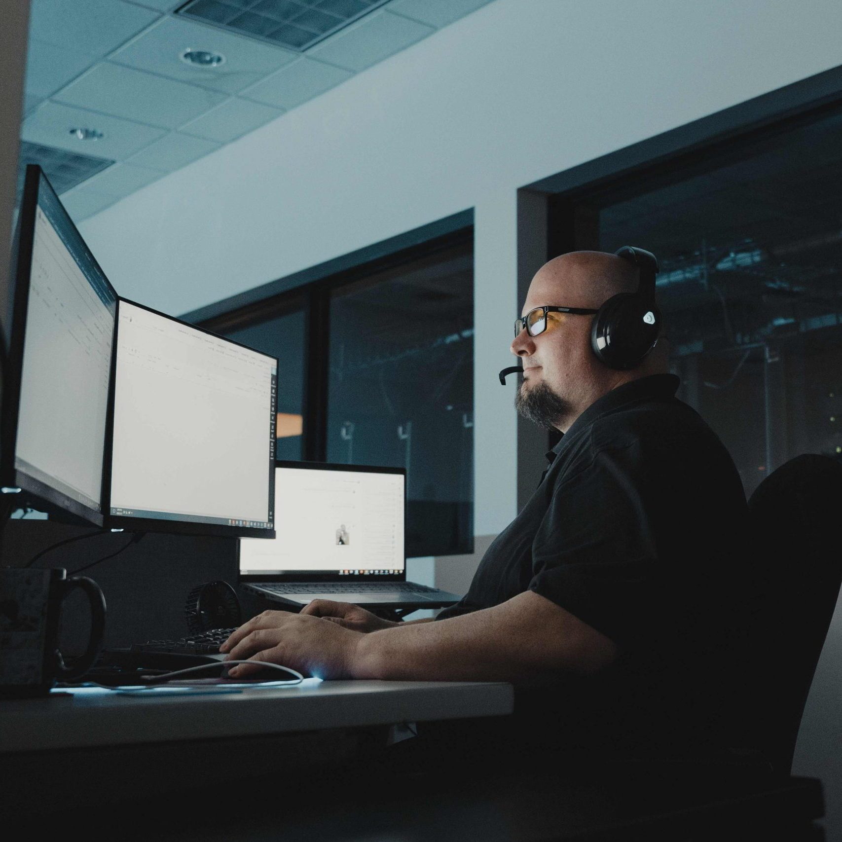 A help desk technician wearing a headset.
