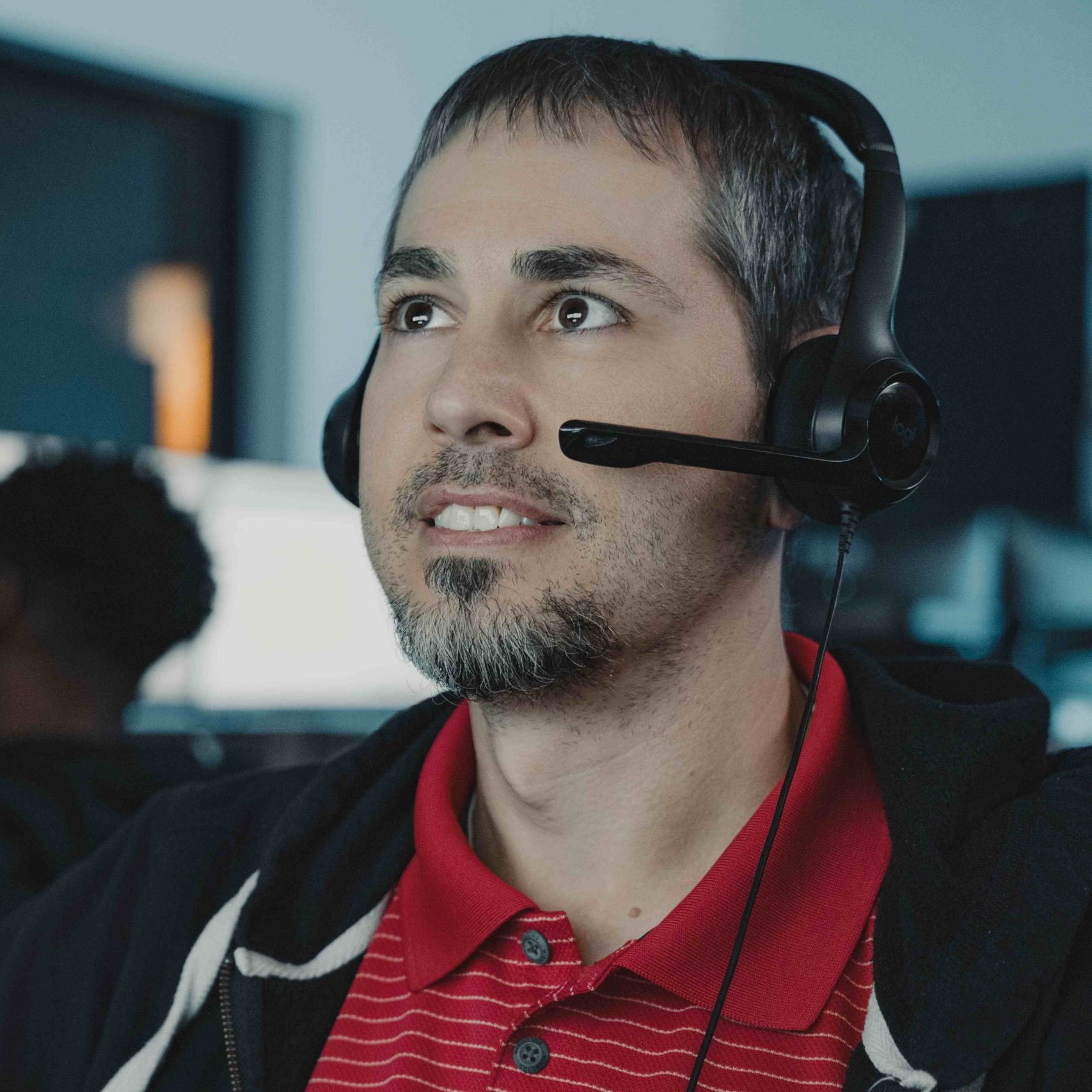 Clear Winds employee wearing a headset providing managed IT services