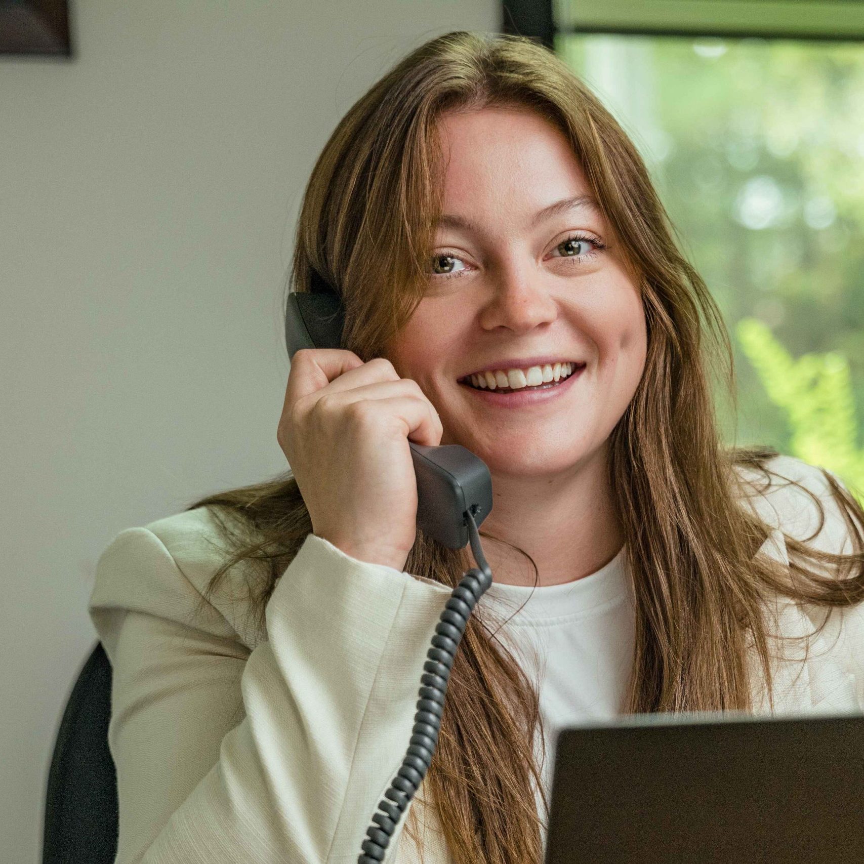 A Clear Winds managed IT services team member talking on the phone.