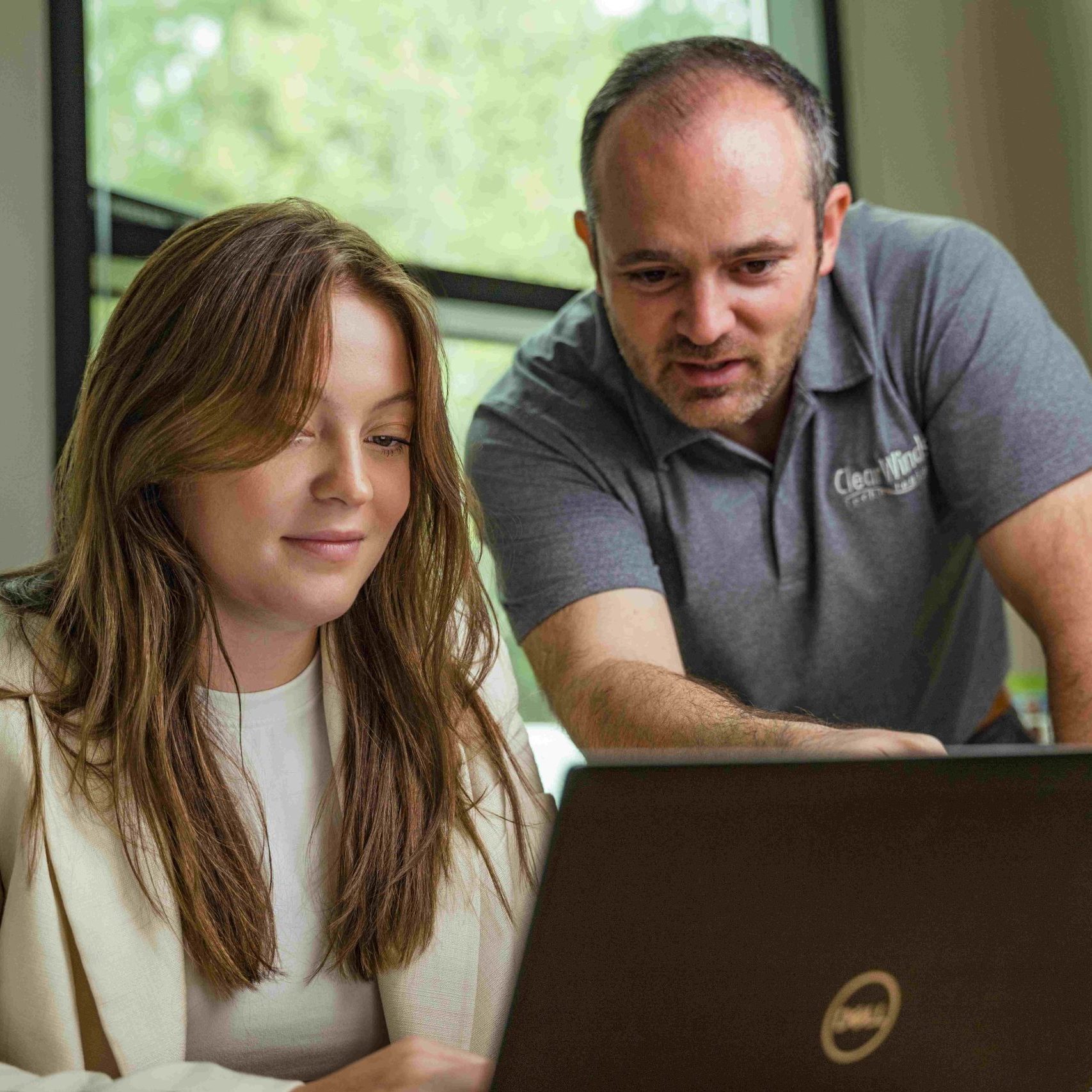 Two members of the Clear Winds team providing high quality IT services.