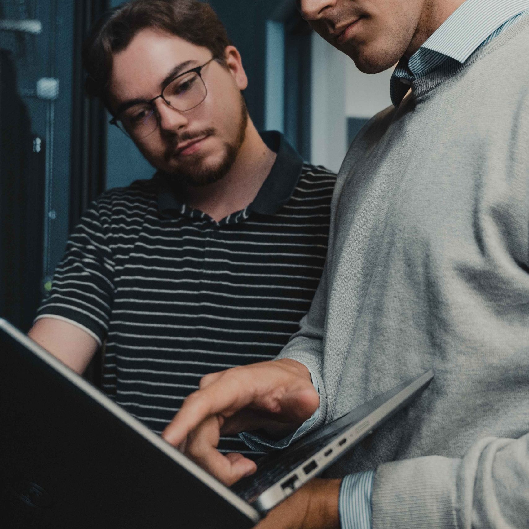 Two Clear Winds Engineers at a server.