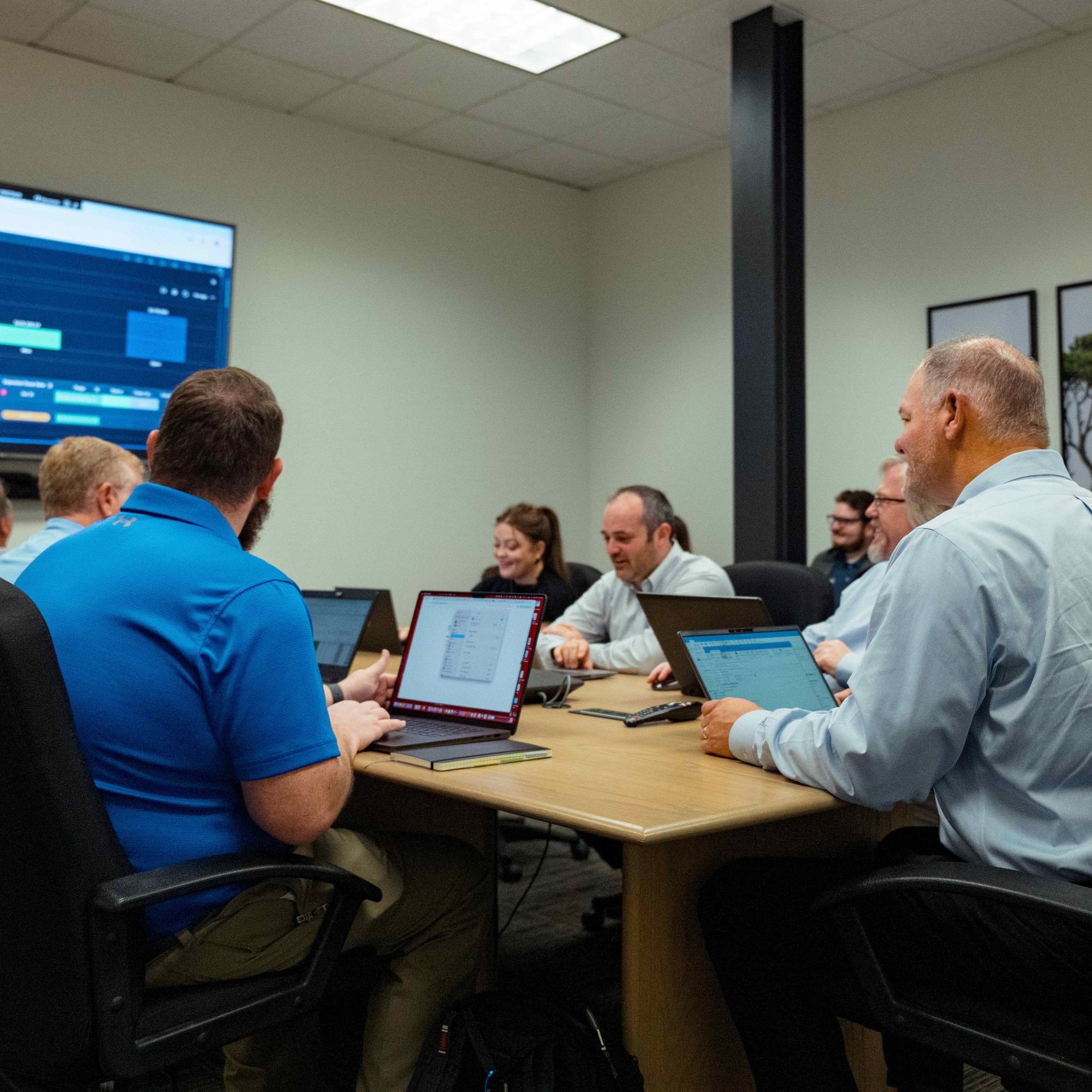 The Clear Winds enterprise IT services team in a meeting.
