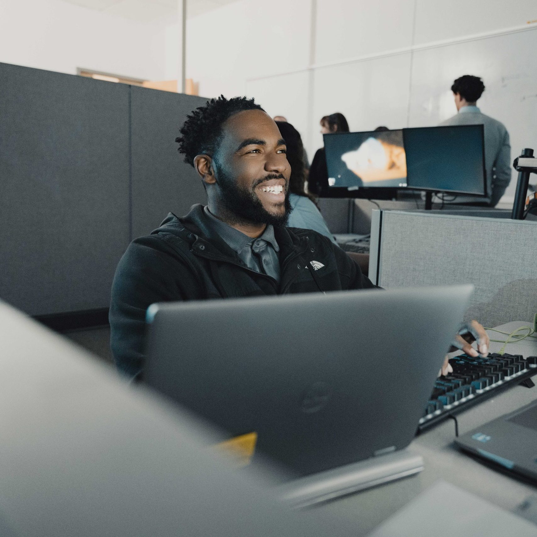 A member of the Clear Winds team at a computer.