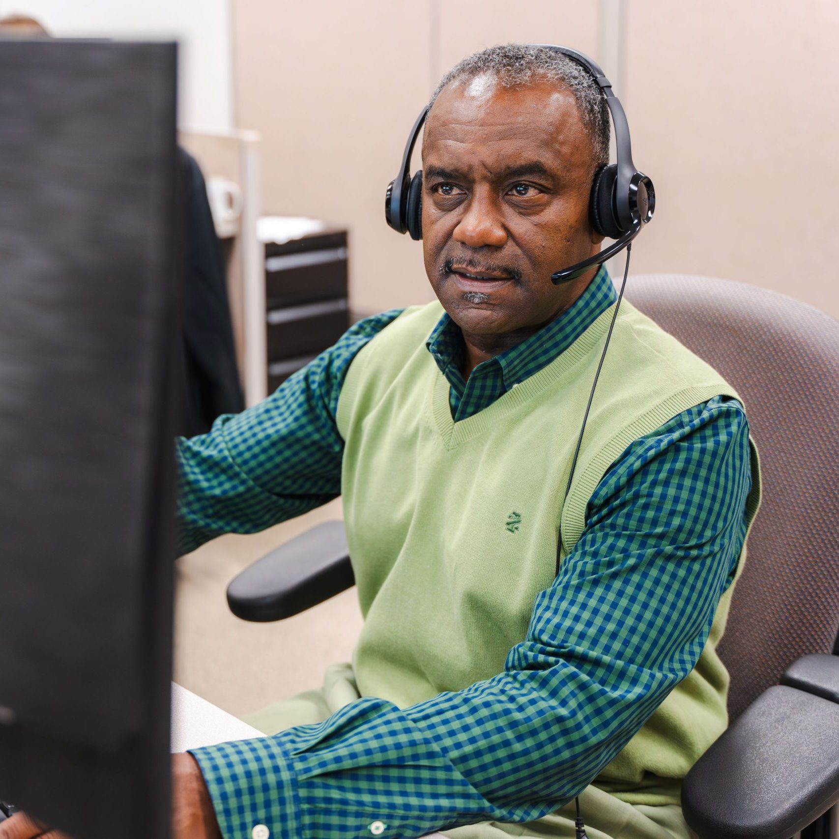 A member of the Clear Winds cloud backup and hosting team at a computer.