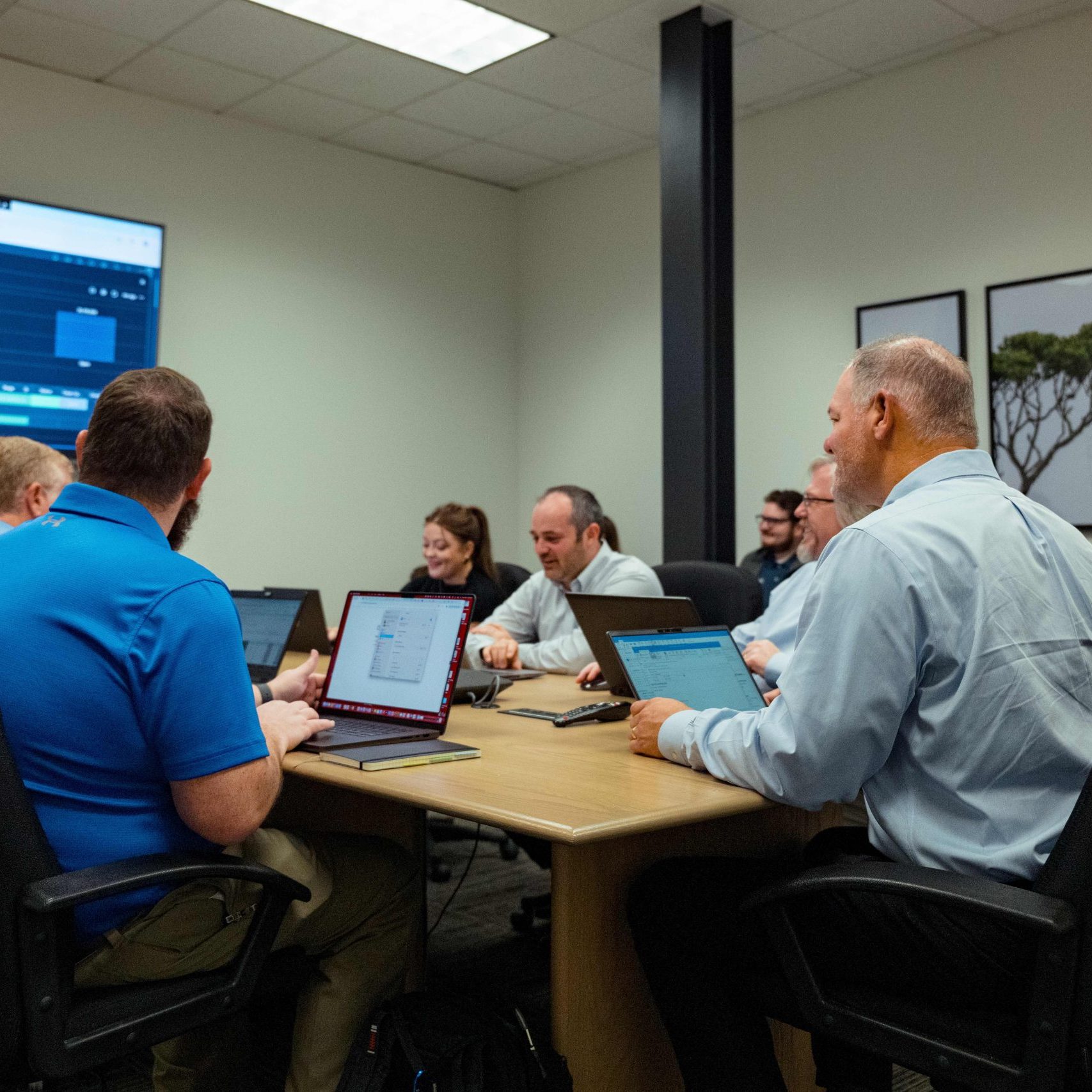The Clear Winds enterprise IT services team at a conference meeting.