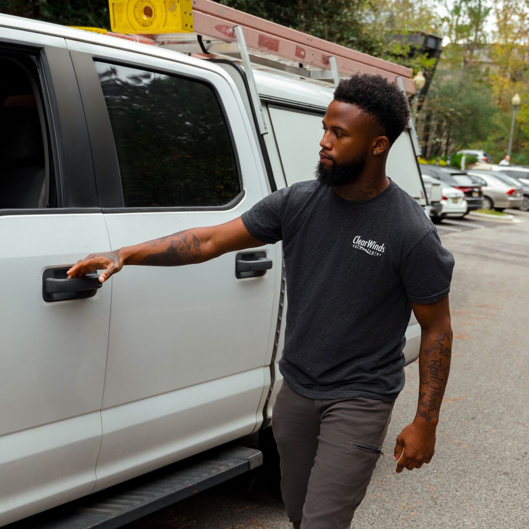 A member of the Clear Winds Technologies cabling team.