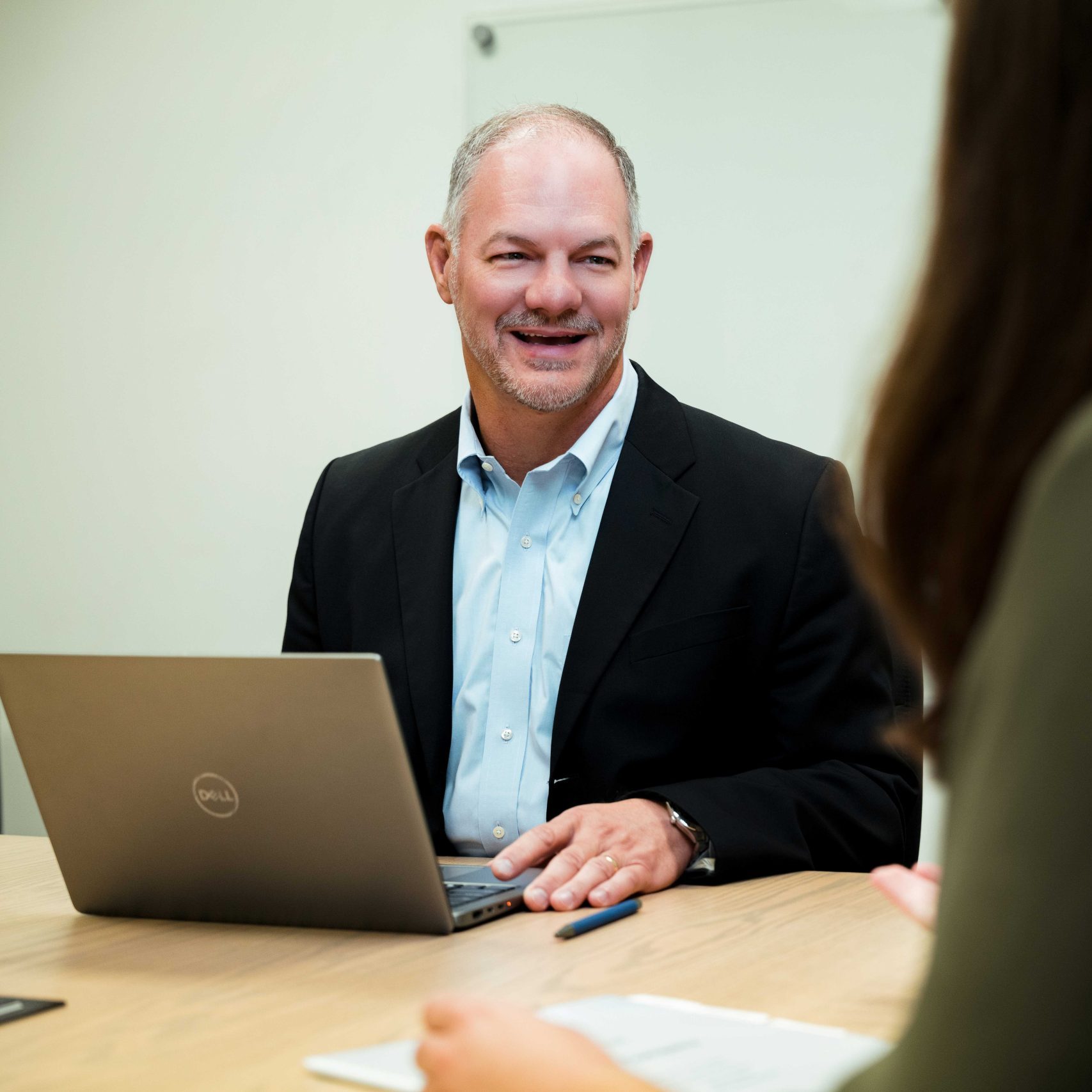 The President and CEO of Clear Winds in a meeting.