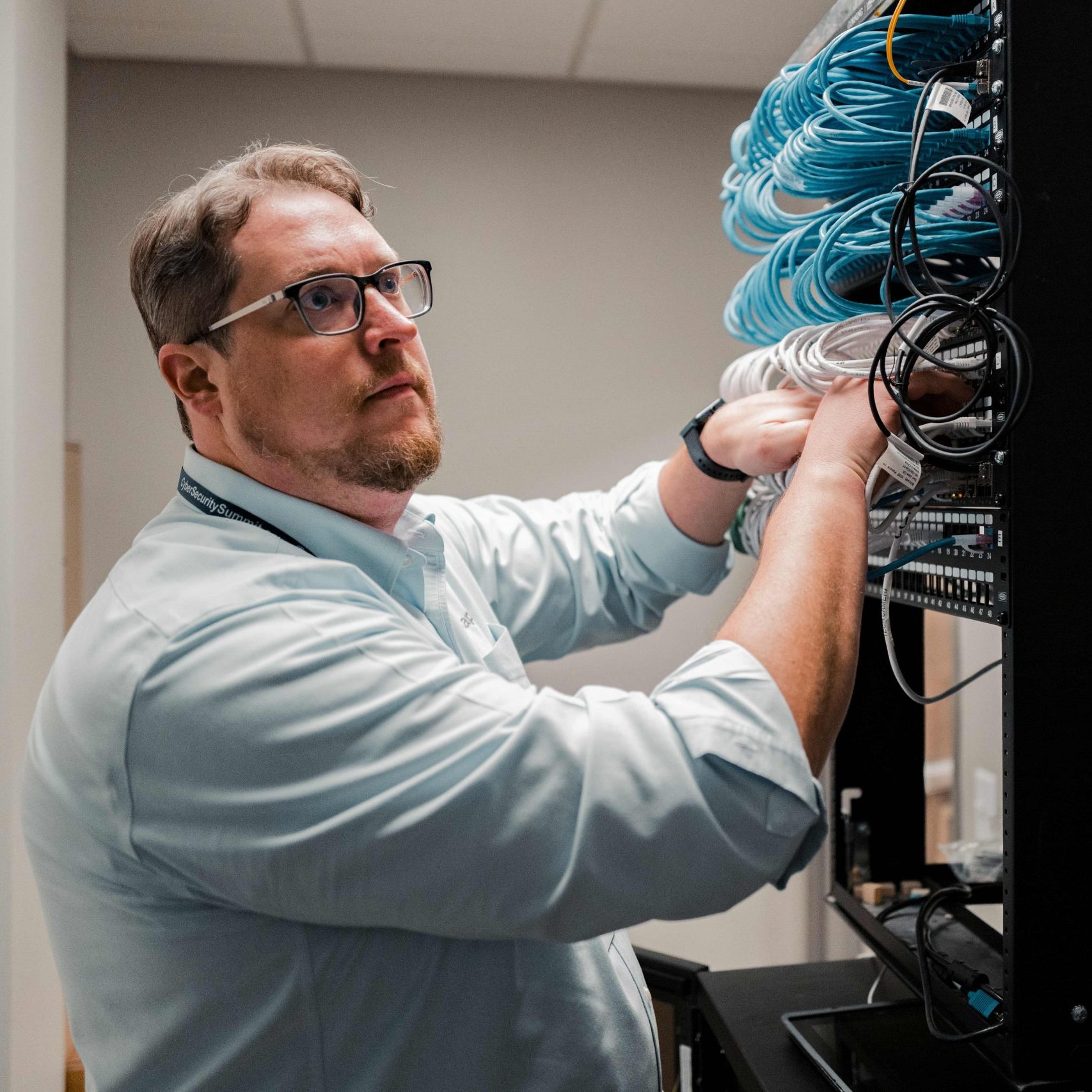 An IT technician in a server room.