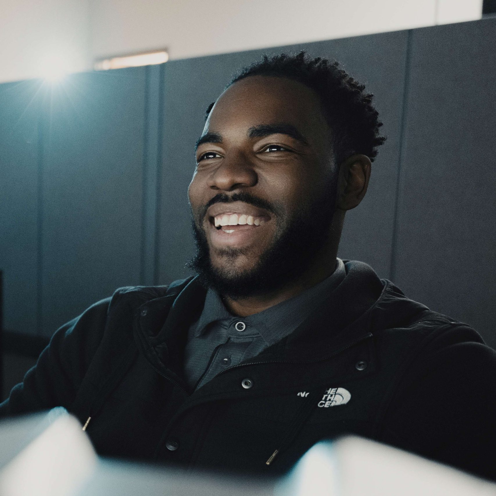 A member of the Clear Winds team at a computer.