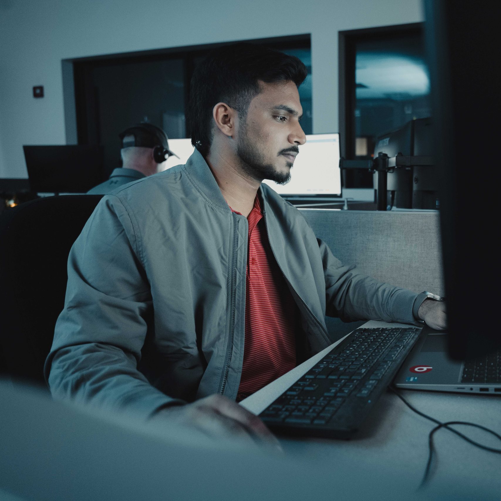 A Clear Winds cybersecurity professional at his computer.