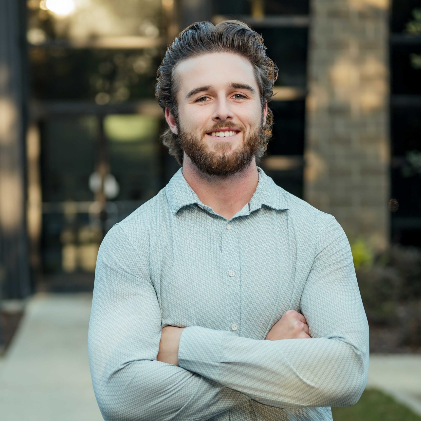 A Clear Winds team member standing in front of the Birmingham location.