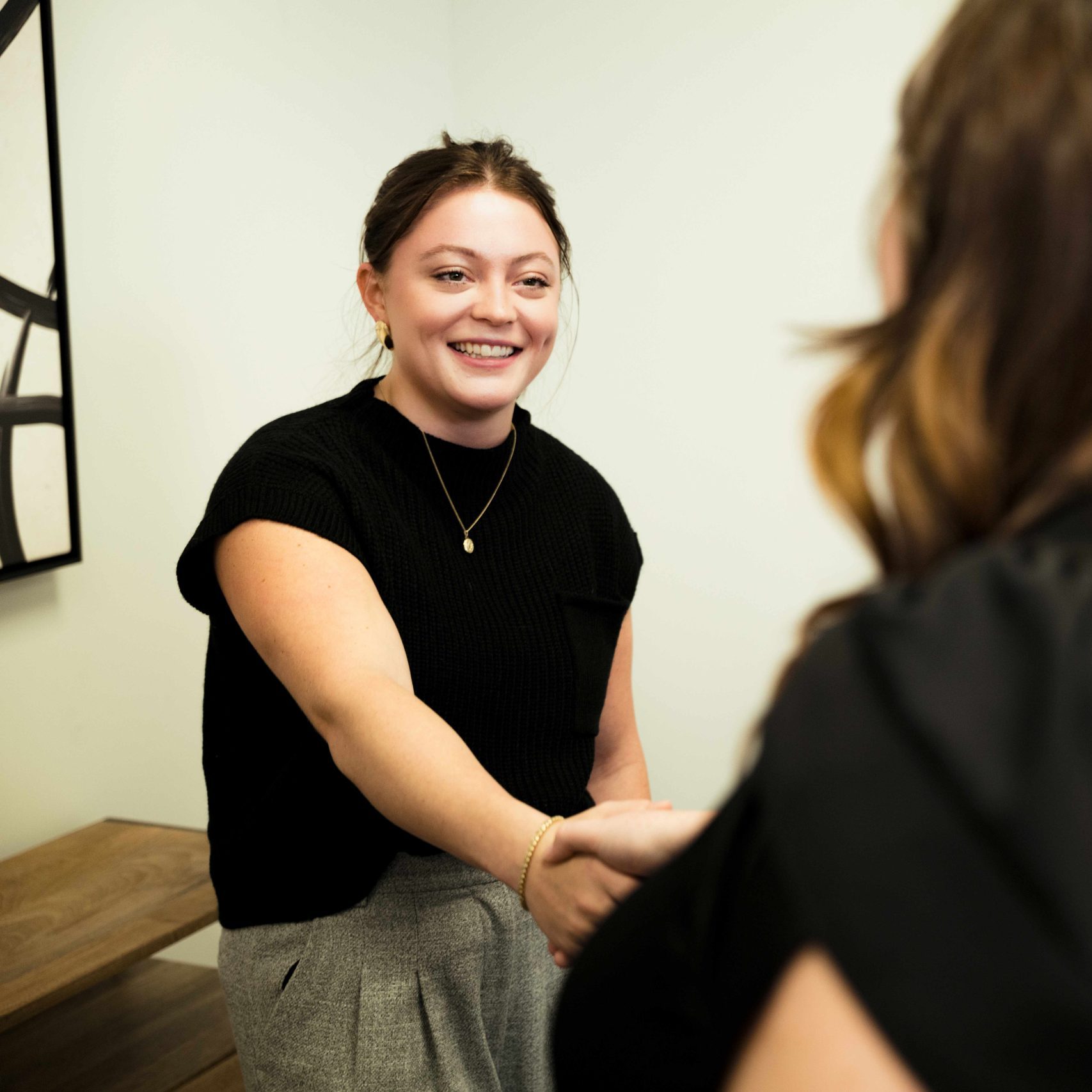 A member of the Clear Winds team meeting with a client.