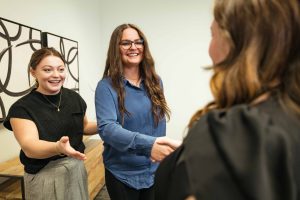 IT Support Austin: Two members of the Clear Winds team shaking hands with a client