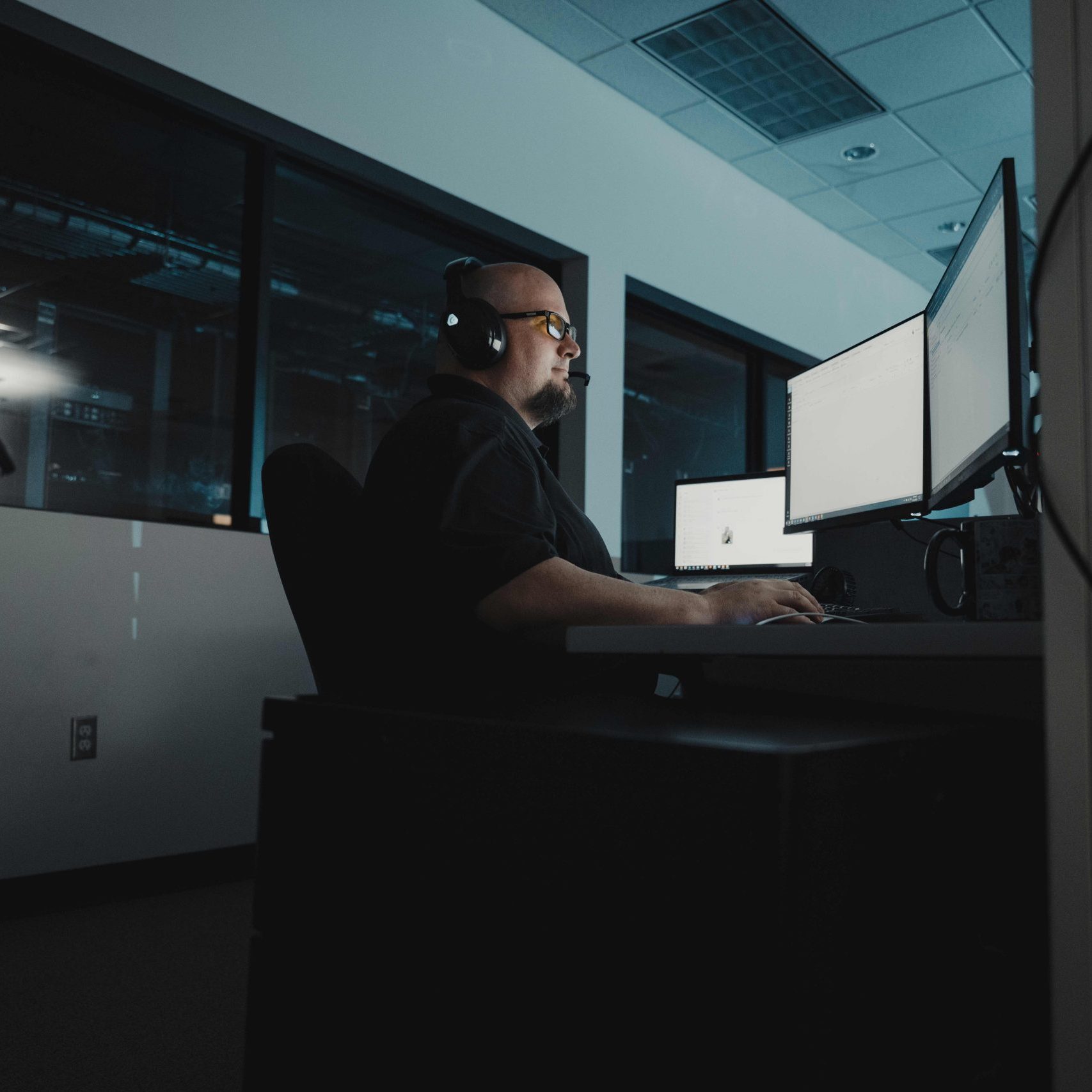 A member of the Clear Winds managed IT services in Hutto team at a computer.