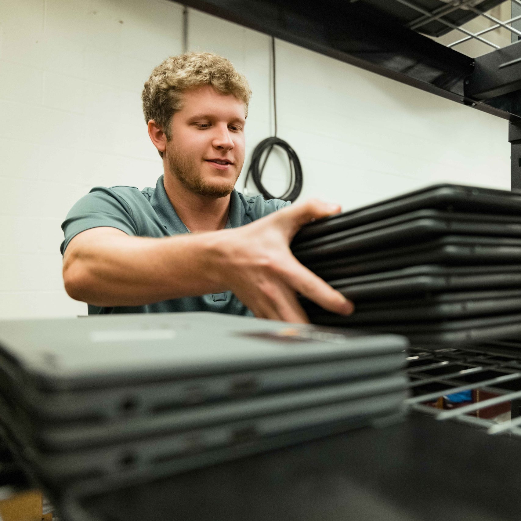 A Clear Winds team member shipping Chromebooks.