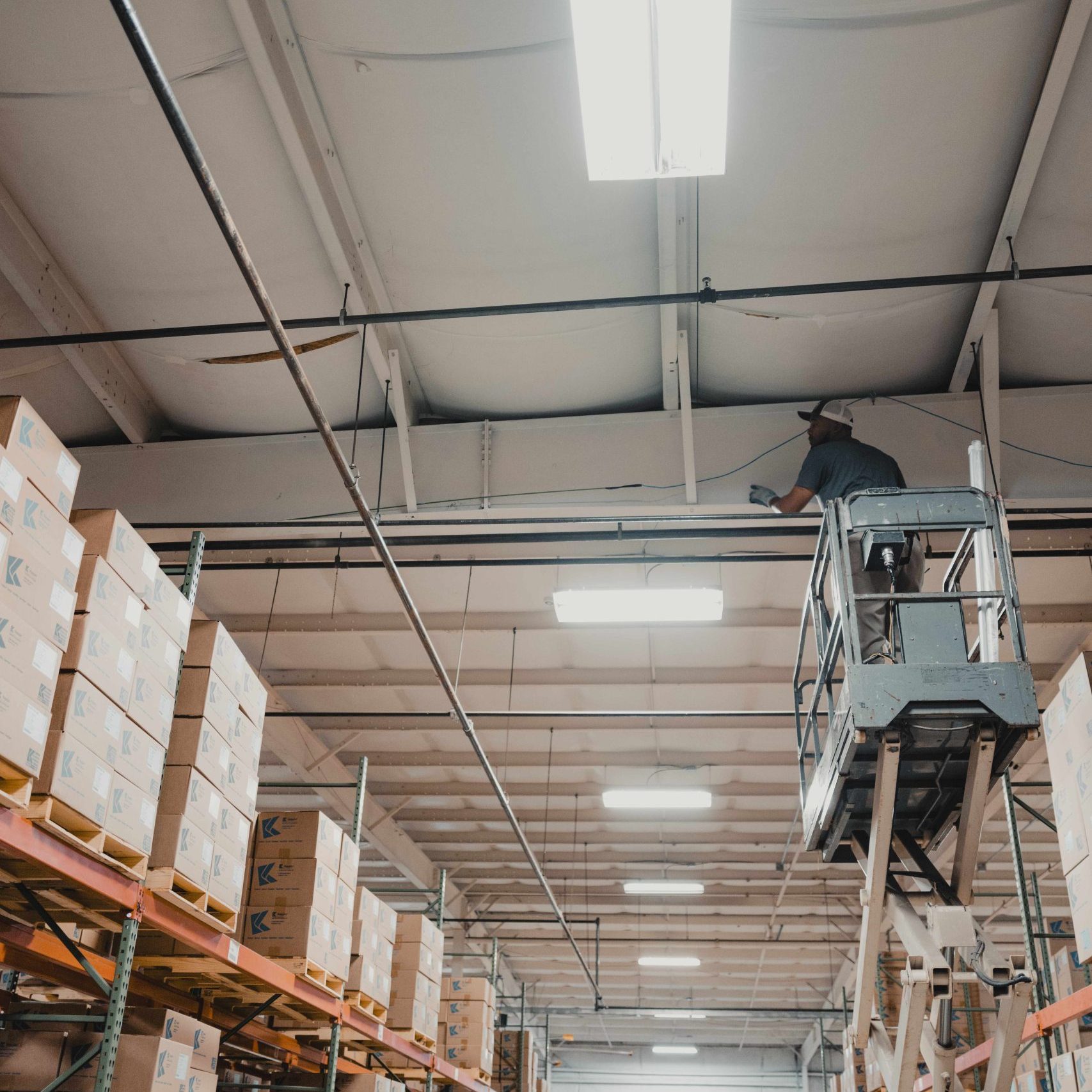 A member of the Clear Winds cabling team on a lift.