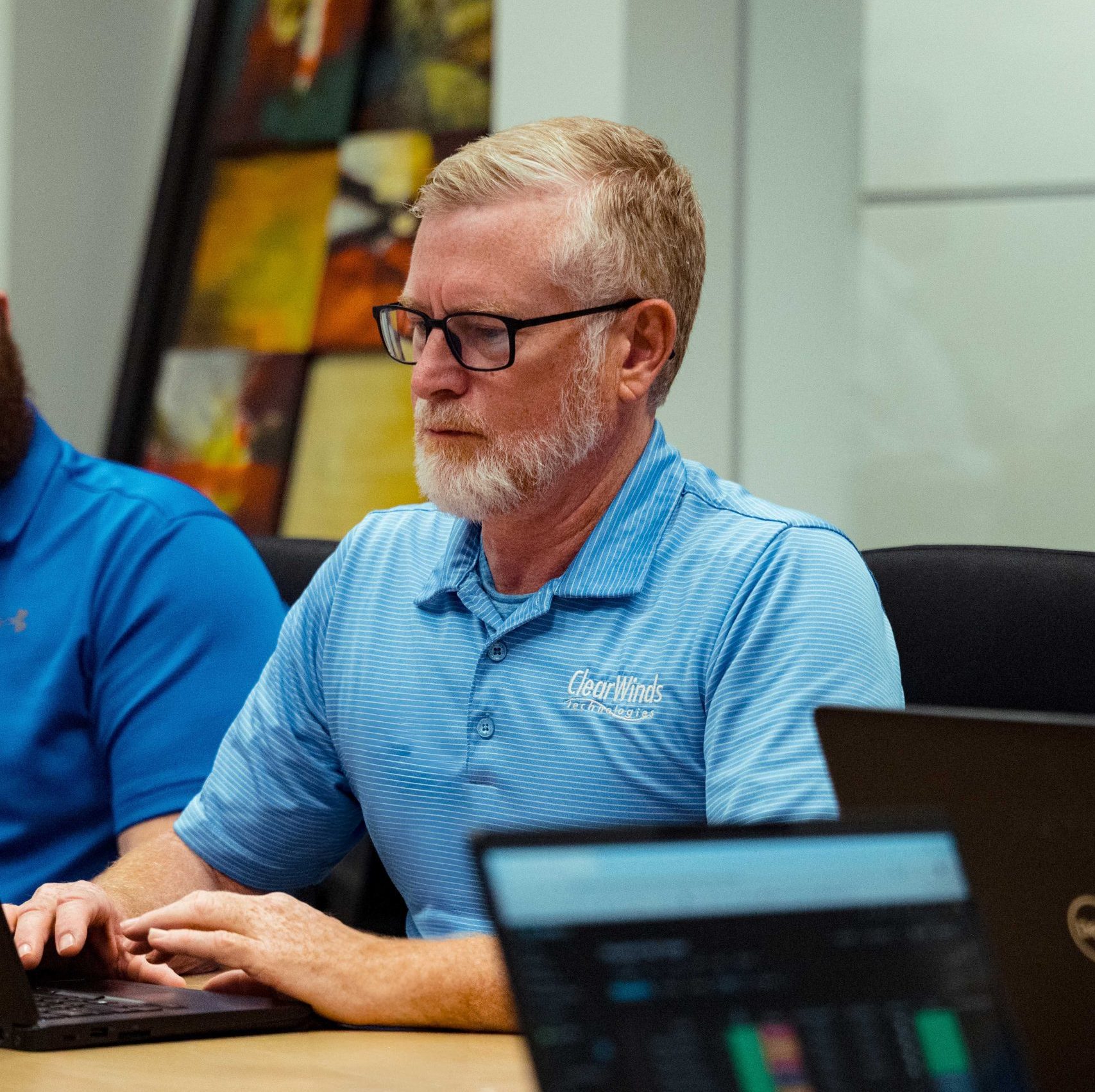 A Clear Winds team member in a meeting.