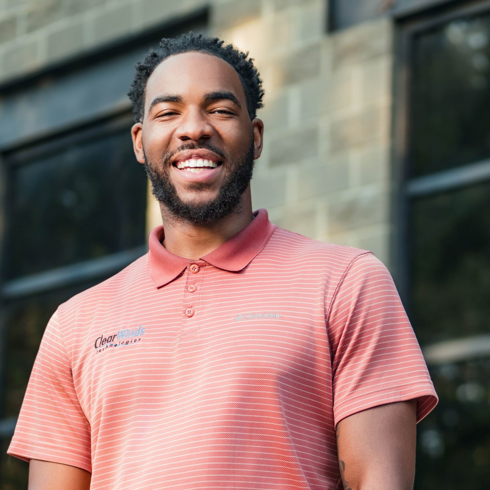 A member of the Clear Winds managed IT services in Garland team smiling.