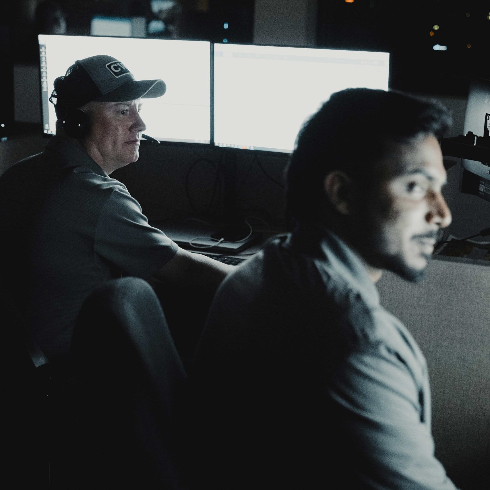 Members of the Clear Winds managed IT services in Katy team at a computer.