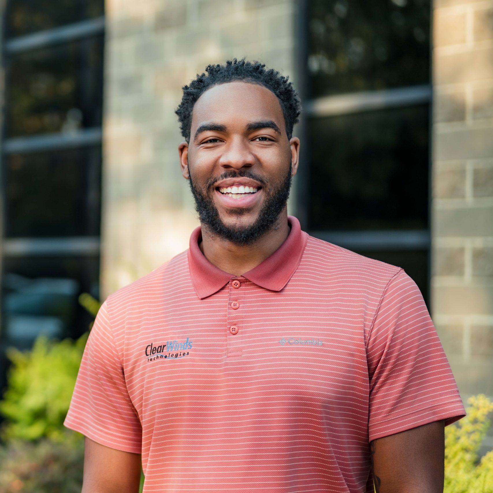 A member of the Clear Winds managed IT services in Mesquite team in front of the office.