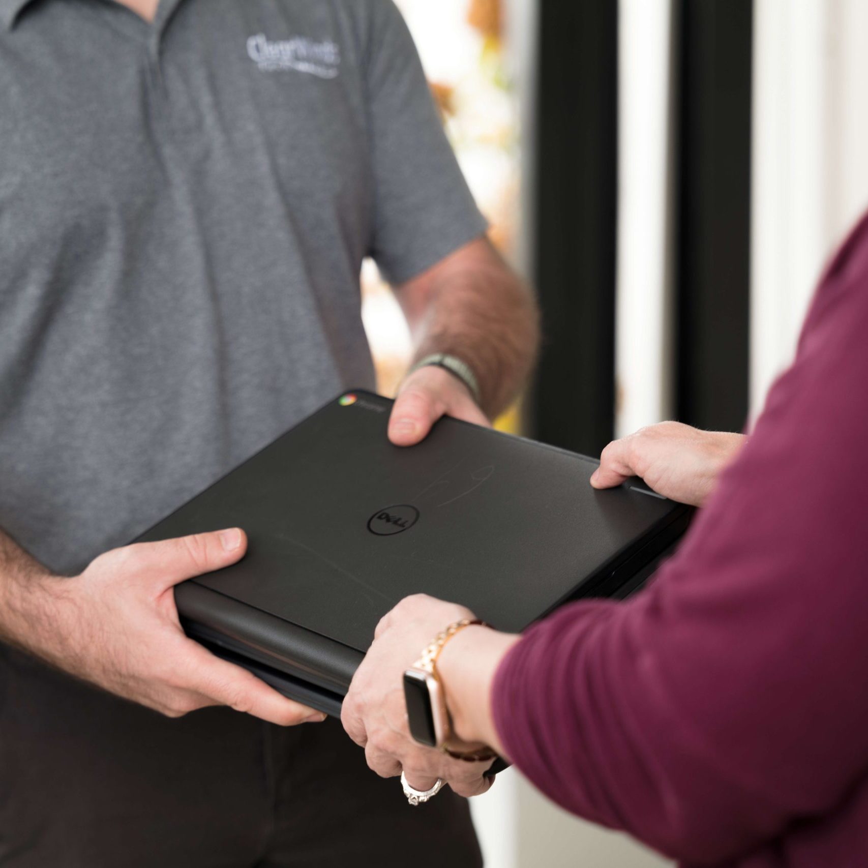A Clear Winds team member delivering Chromebooks.